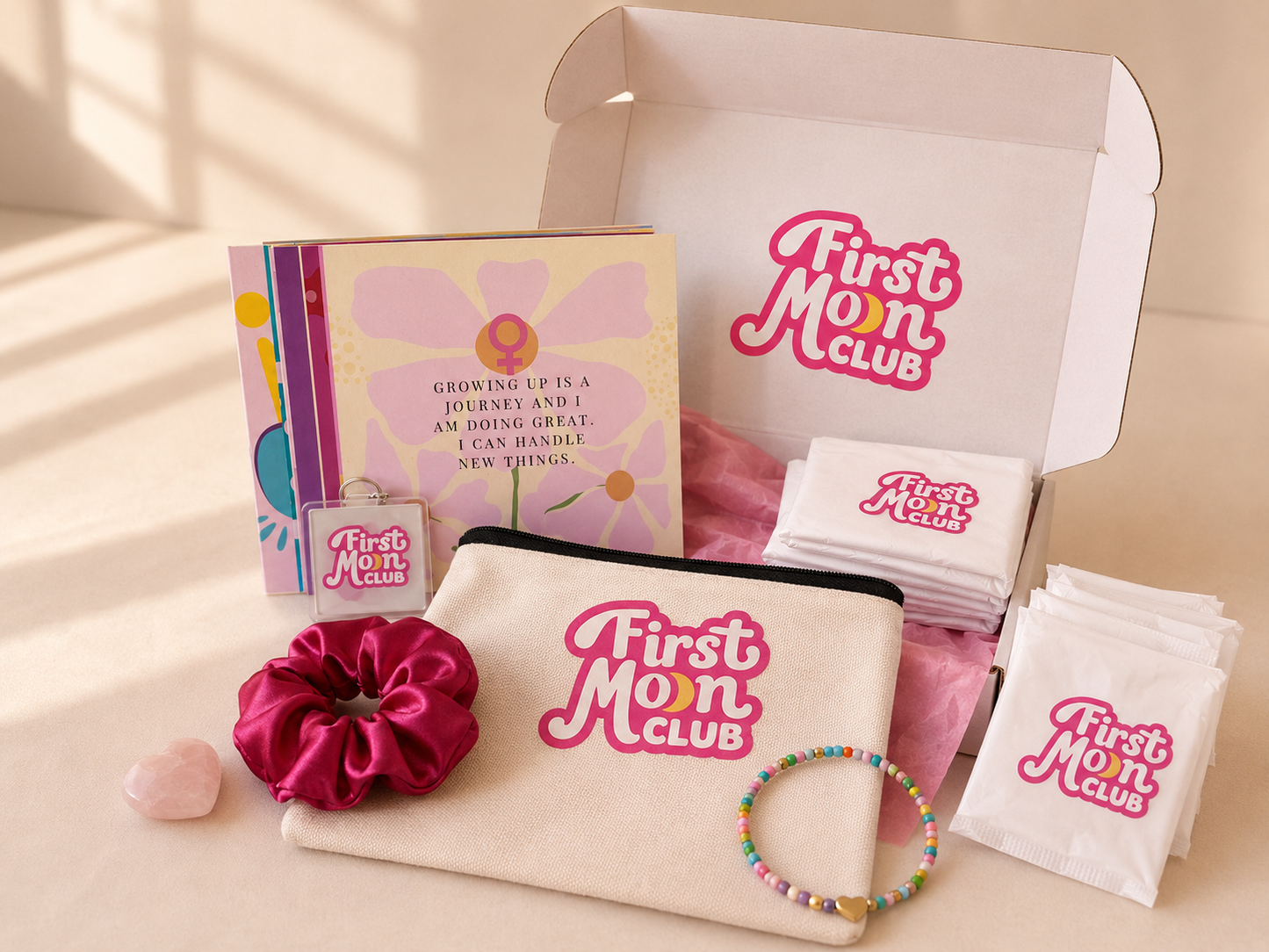 First Mom Club product set including a pouch, scrunchie, and other items on a light background